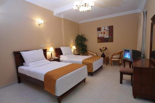 Le Grand Hotel Doha Zimmer foto